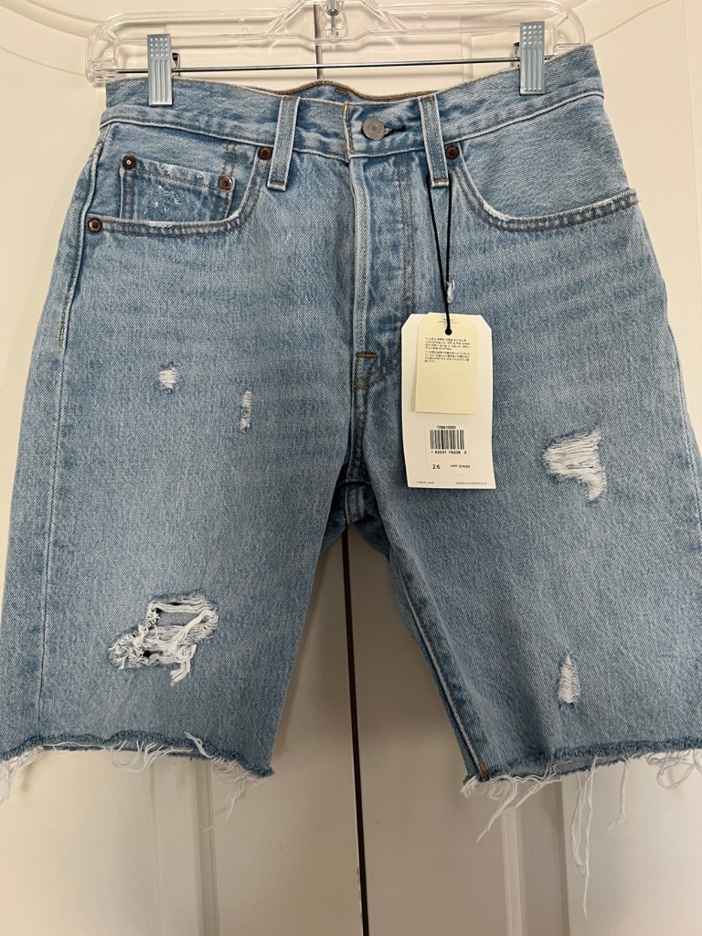 Levi's Light Blue High-Rise Distressed Raw Hem Denim Shorts
Size 26